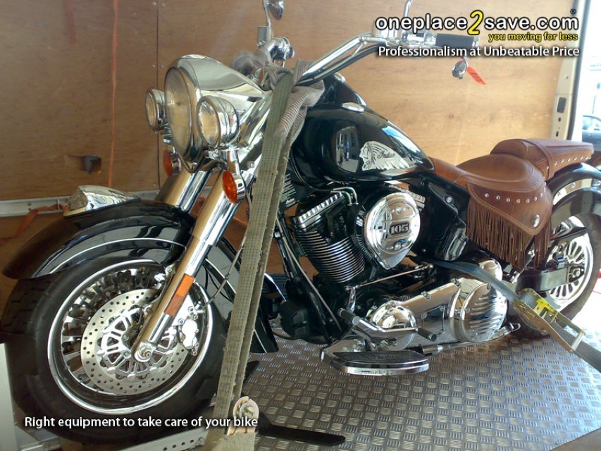 Motorcycle being secured inside a recovery vehicle