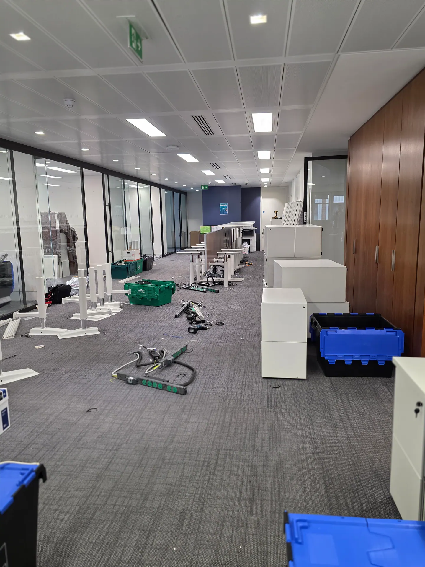 Evercore office floor during furniture reconfiguration in London.